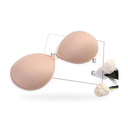 Self-adhesive strapless bra on a white background