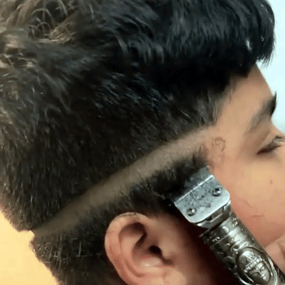 Fade haircut done with the T-blade clipper