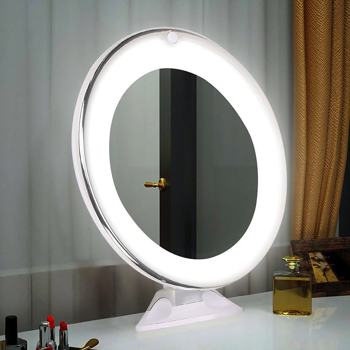 Lit LED makeup mirror on a dressing table